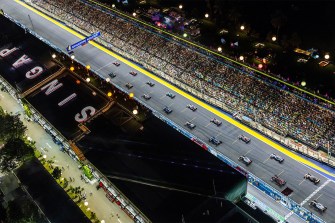 A line of F1 cars at the starting lines of the Singapore Grand Prix.