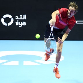 Daniil Medvedev serving the tennis ball in a match.