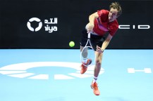 Daniil Medvedev serving the tennis ball in a match.