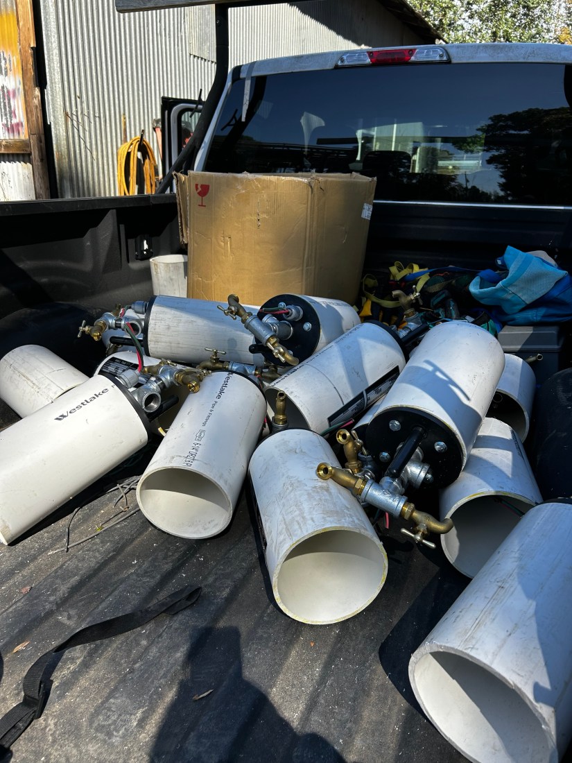 Well pumps in the bed of a truck.