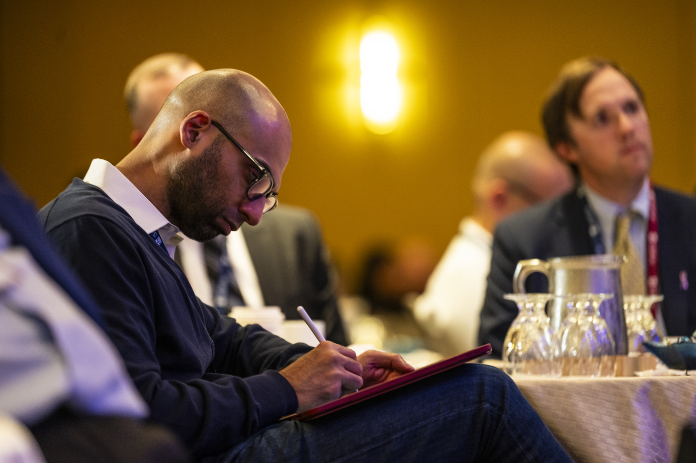 Audience members listening to President Aoun at his keynote address at the Ash Carter Exchange.