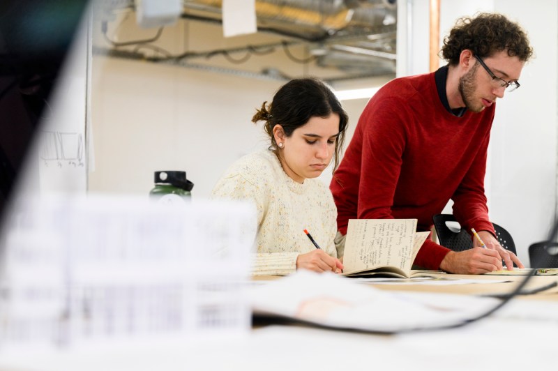 Two students working in an architecture capstone course.