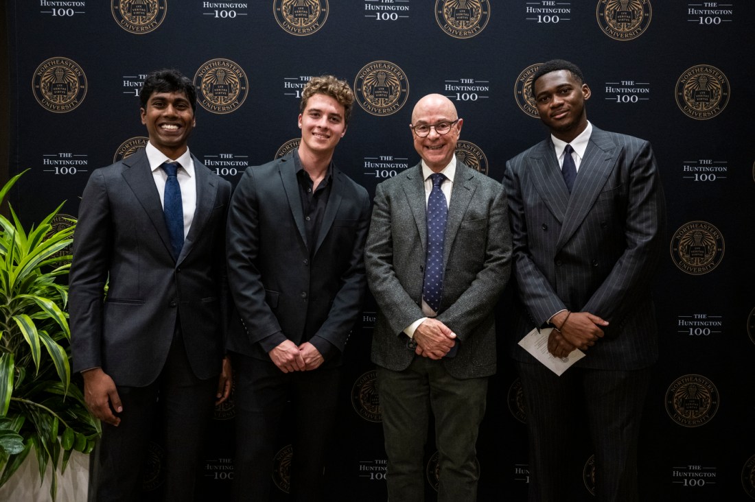 President Aoun posing with three Huntington 100 inductees.