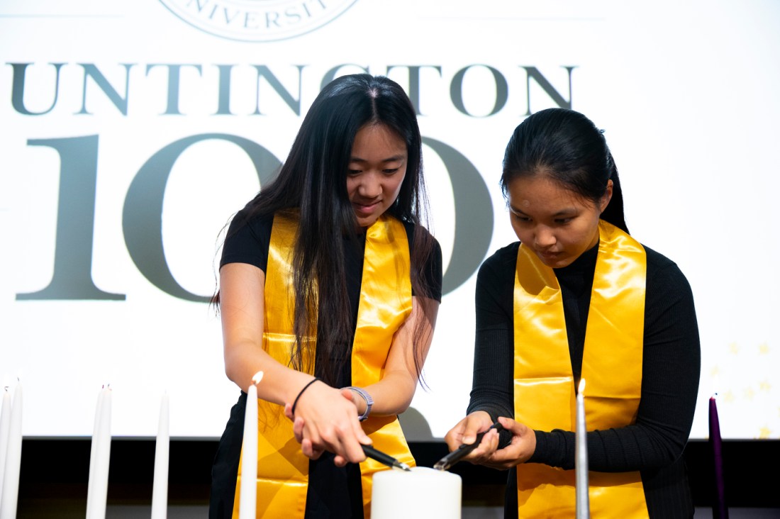 Two Huntington 100 inductees wearing yellow sashes. 