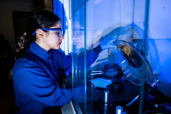 A researcher working in a lab setting.