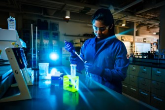 Sumedha Reddy Sudini working in a lab.