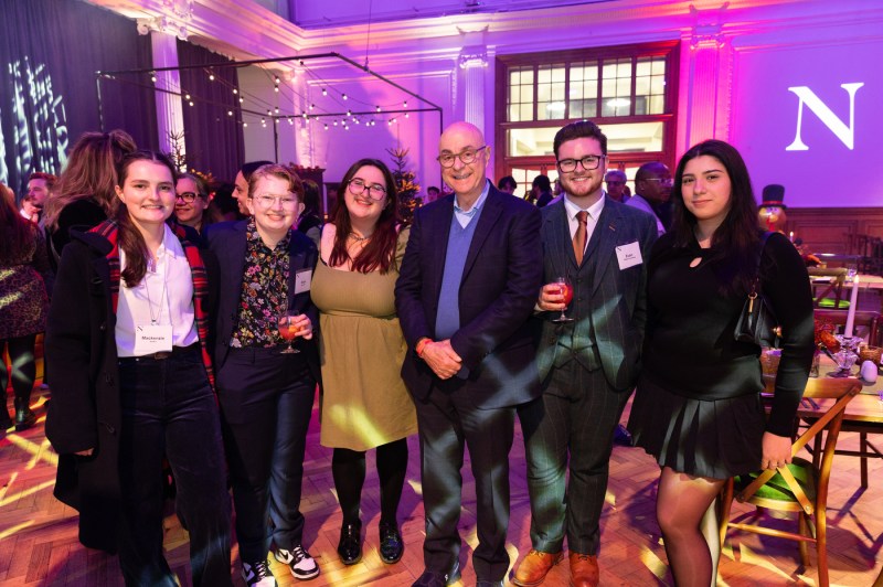 President Aoun poses with students and faculty during Northeastern’s Thanksgiving celebration in London.