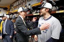 David Poile congratulating Roman Josi.