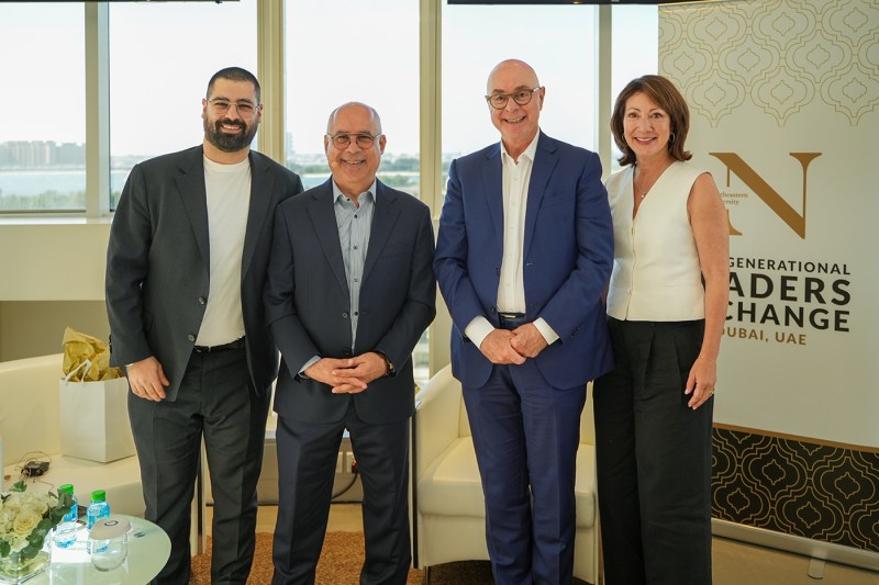 President Aoun and Diane Nishigaya MacGillivray posing with two other people.