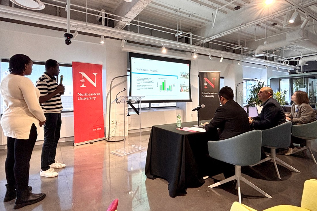 Students presenting at a hackathon.