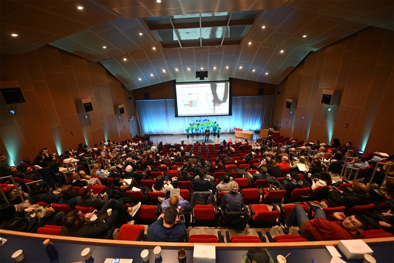 A room full of audience members at TED Planet Action summit.