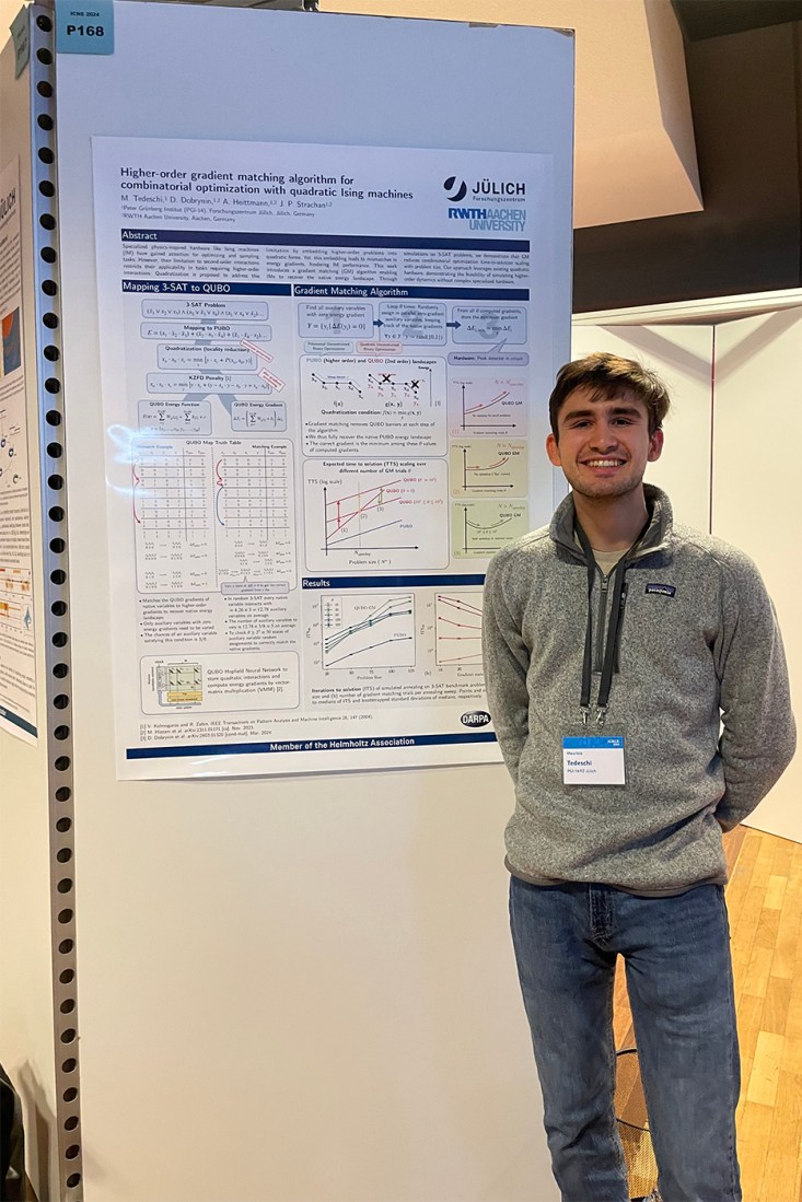 Mauricio Tedeschi standing in front of a presentation board.