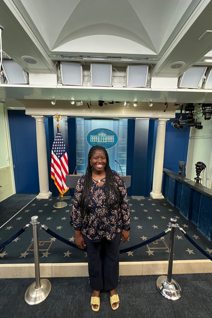 Siima Machayo posing at the white house.