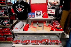 A table of Northeastern branded merchandise, a lot of it in the color red, in the bookstore.