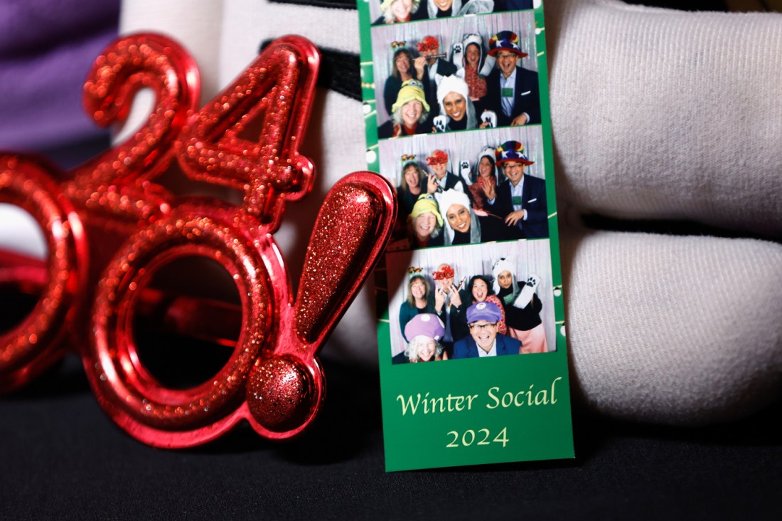 A polaroid photo strip of people celebrating at the Holiday Social in Oakland.