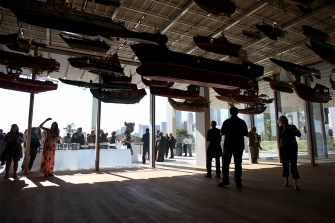 People standing about in the Perez Art Museum.