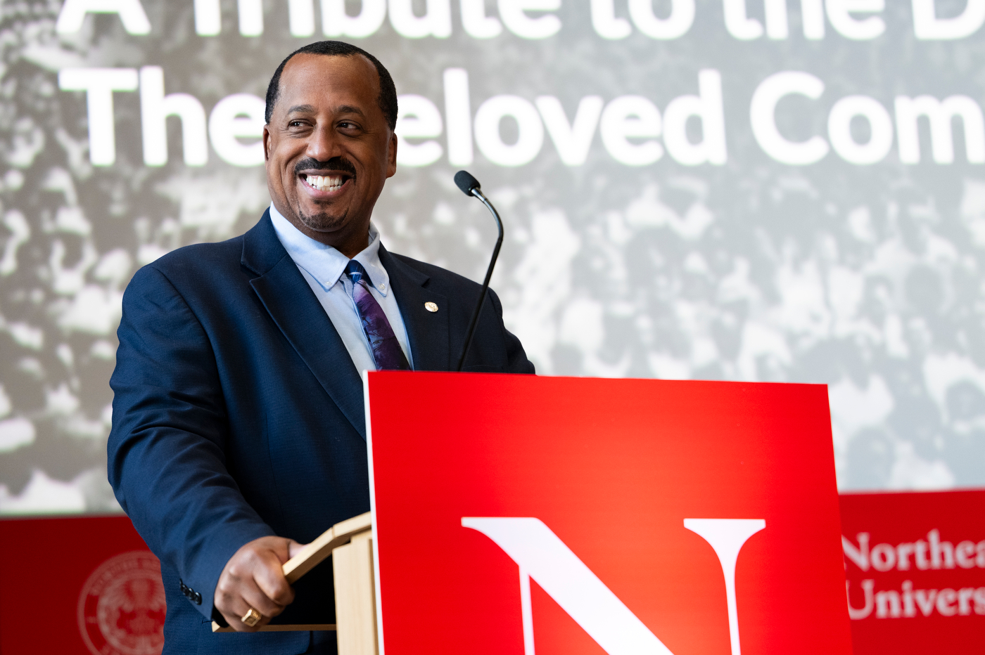 A speaker at the podium at the MLK Jr event.