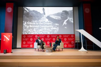 Two people on stage at the MLK Jr event.