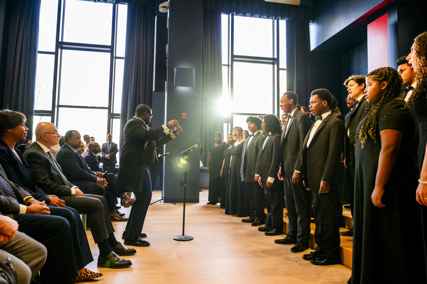 An ensemble of singers on stage.