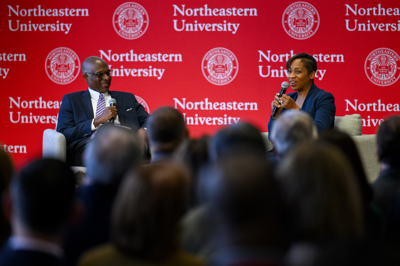 Two speakers sitting on stage for the MLK Jr event.