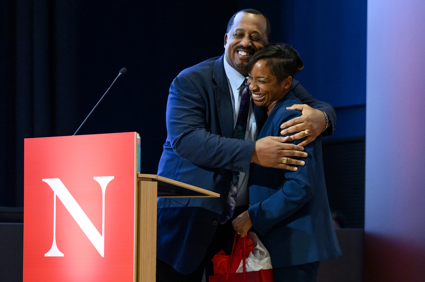 Two people hugging at the MLK Jr event.