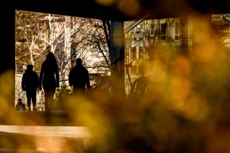 Students walk through a campus.