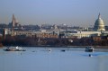 The view of a river in DC from a bridge where search and rescue crews are in boats on the water.