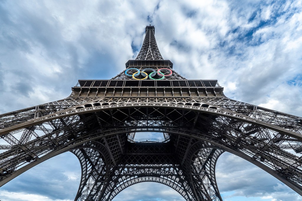 The Olympic rings on the Eiffel Tower, as seen from the base.