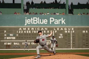 Northeastern pitcher Max Gitlin throws a pitch during the first inning of the Huskies' spring training game against the Red Sox at JetBlue Park.