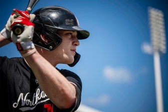 Alex Lane up at bat on a sunny day.