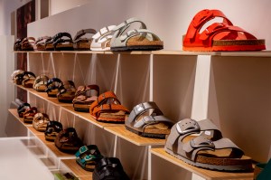 Shelves of Birkenstock sandals displayed in a store.