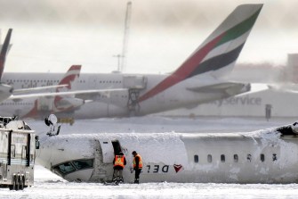 A Delta Plane upside down on the runway in Toronto.