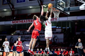 Rashad King taking a shot on net in a basketball game.