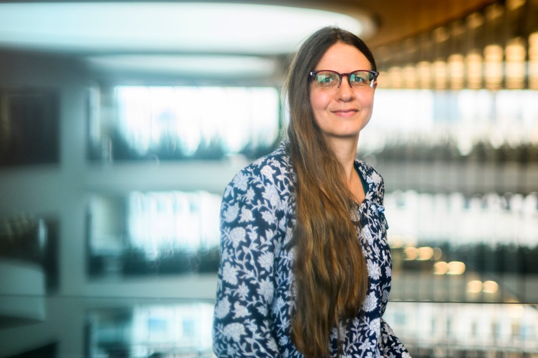 Susanne Jaeggi, a professor of psychology at Northeastern University, wearing glasses and a patterned blouse, sits in a well-lit space with a blurred background.