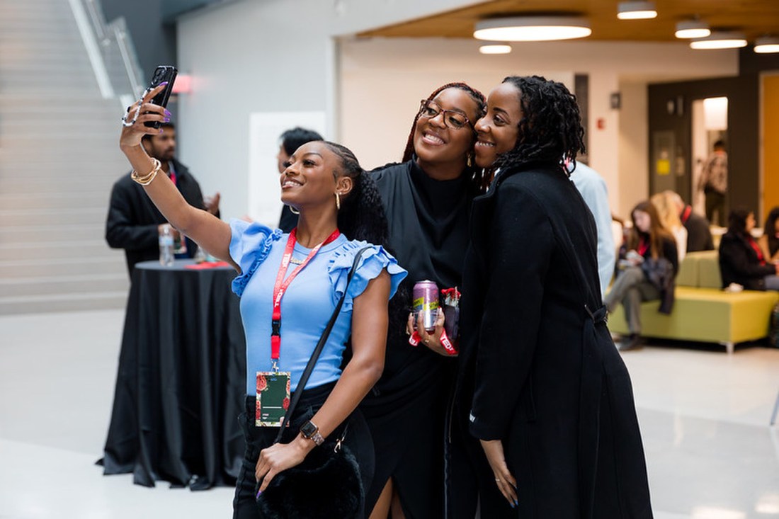 Three people posing for a selfie. 