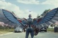 A screen capture from the new 'Captain America' movie of a superhero with falcon wings standing in a parking lot, seen from behind.