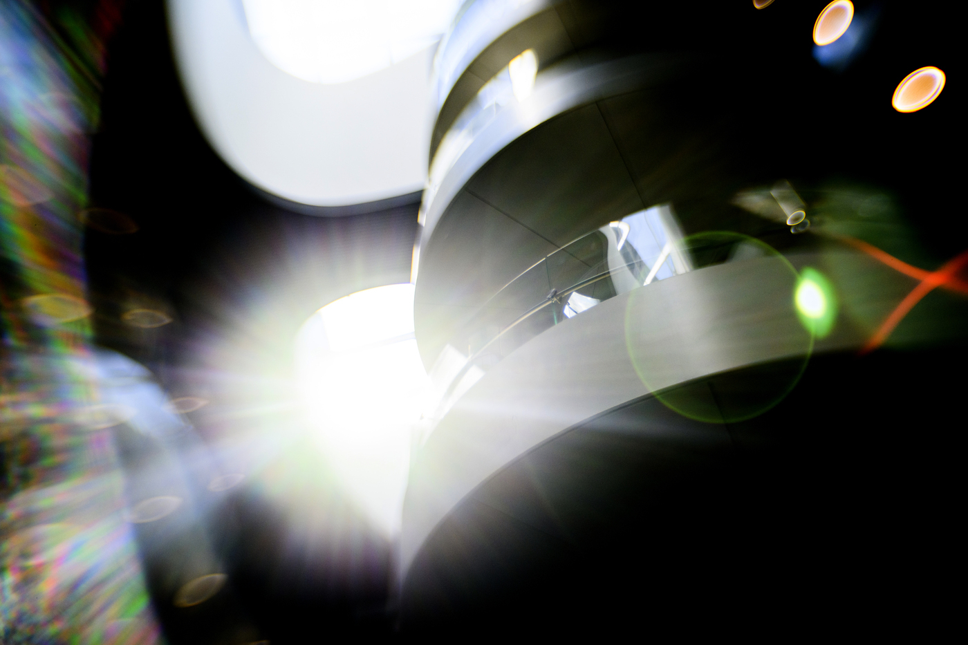 A light flare coming from behind the ISEC spiral staircase