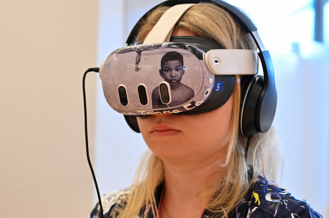 A person with blonde hair wearing a VR headset.