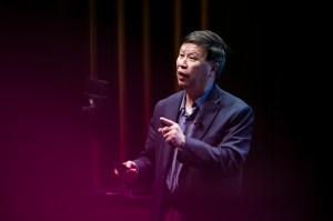 Ning Wang speaking at a global summit.