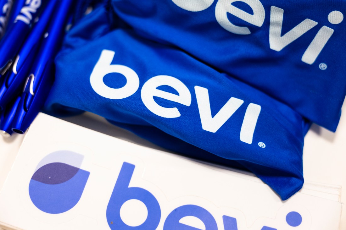 Blue and white t-shirts with the 'Bevi' logo on them.