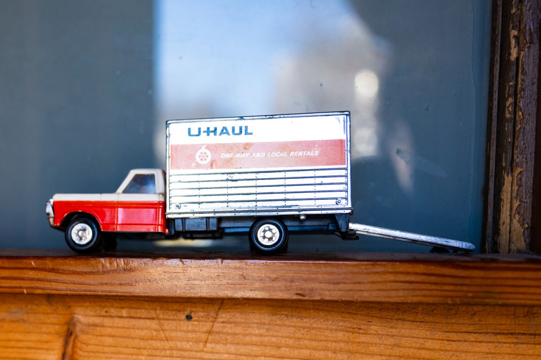 A small U-Haul box figurine.