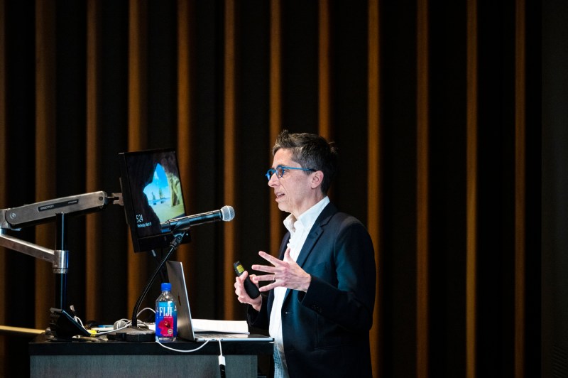 Alison Bechdel speaking on stage.