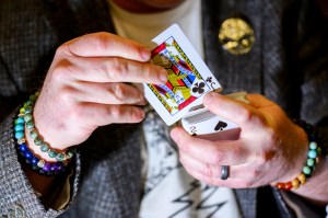 Stephen Wood performing a magic trick with cards.