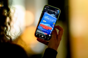 A person holding their phone open to a TikTok advertising a powder to lower your cortisol levels.