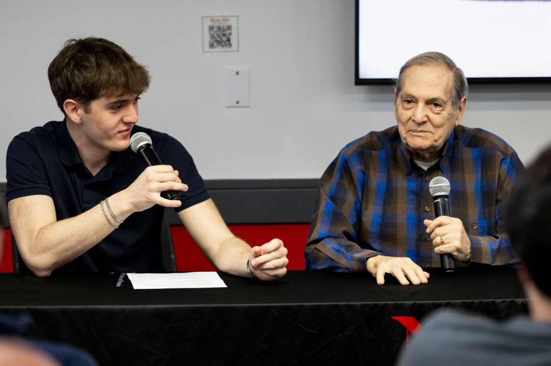Noah Ben-Zion and Dr. Joseph Berger sitting next to each other holding microphones.