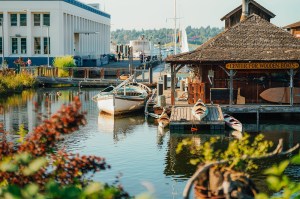 A lakehouse with a boat beside it in Seattle.