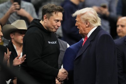 Elon Musk and Donald Trump shaking hands.