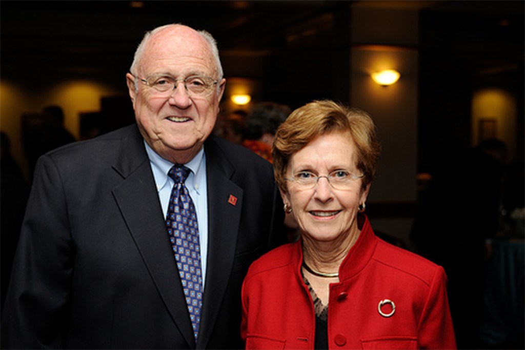 Portrait of Richard C. Ockerbloom and a woman next to him in red.