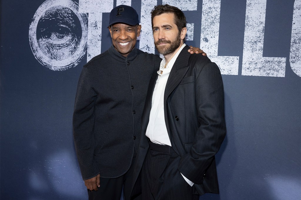 Denzel Washington (left) and Jake Gyllenhaal (right) posing for photos.