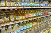 Shelves full of seed oils at a grocery store.